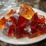 Colorful Cinnamon Rock Candy pieces in a decorative jar