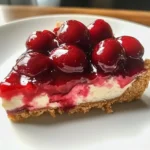 A delicious serving of Classic Cherry Delight dessert topped with cherries.