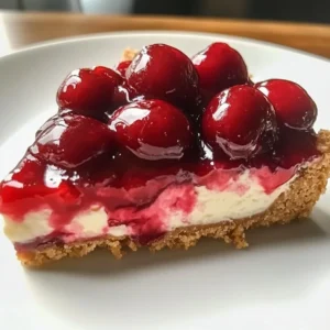 A delicious serving of Classic Cherry Delight dessert topped with cherries.
