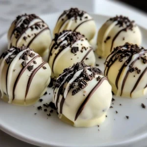 Delicious white chocolate mint Oreo truffles on a decorative plate