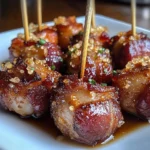 Bacon wrapped water chestnuts appetizer served on a platter