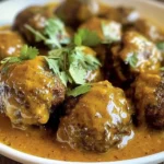 Delicious jerk meatballs in coconut curry sauce served in a bowl