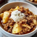 Delicious homemade apple crisp dessert with a crunchy topping and warm apple filling.
