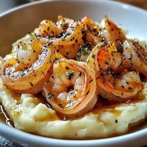 Delicious creamy garlic shrimp served over fluffy mashed potatoes