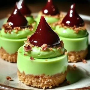 Festive Grinch mini cheesecakes decorated for Christmas