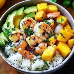Shrimp avocado mango bowl with vibrant ingredients and garnishes