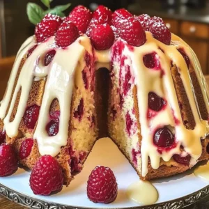 Delicious White Chocolate Raspberry Bundt Cake with fresh raspberries and white chocolate glaze