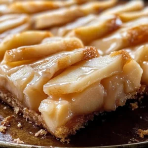 Delicious Chicago-Style bakery apple slices with a golden crust and fresh apples