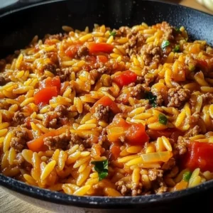 Ground Turkey Orzo Skillet with vegetables in a frying pan.