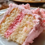Deliciously festive Pink Champagne Cake topped with creamy frosting.
