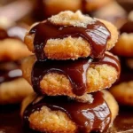 Delicious Twix Thumbprint Cookies with chocolate and caramel filling
