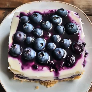 Blueberry Vanilla Cheesecake Icebox Cake topped with fresh blueberries.