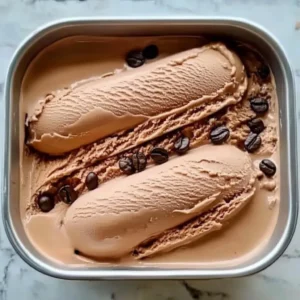 Delicious bowl of homemade coffee ice cream topped with coffee beans