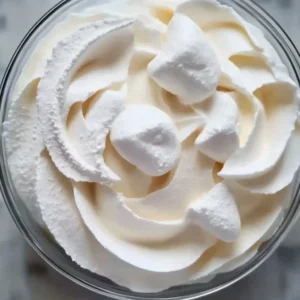 Delicious creamy marshmallow buttercream frosting on a cake