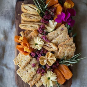 Edible flower crackers with vibrant flowers for a delightful snack.