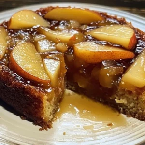 Delicious slice of pear upside down cake with caramelized pears on top