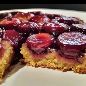 Freshly baked Plum Upside Down Cake with caramelized plums on top