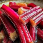 Jar of Simply Divine Candied Rhubarb, showcasing sweet and tart flavor blend.