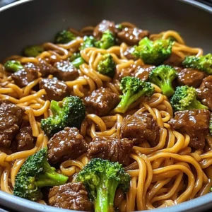 Beef and Broccoli Lo Mein Noodles served in a bowl with chopsticks