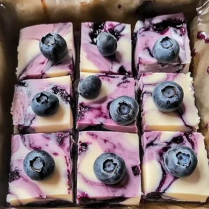 Blueberry cheesecake yogurt bark with fresh blueberries and creamy layers.