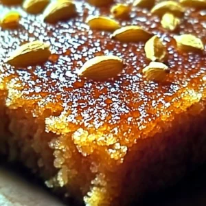 Delicious Cardamom Semolina Cake topped with decorative icing and spices.
