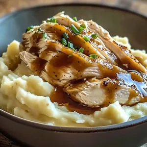 Delicious chicken mashed potato bowls with gravy and herbs served in a bowl