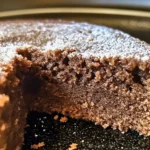 A slice of irresistible farmhouse ginger spice cake topped with cream frosting.