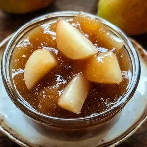Homemade irresistible pear jam in a jar with fresh pears and a slice of bread